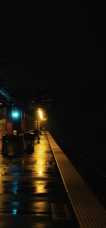 Generic stock photo of a train station platform at night